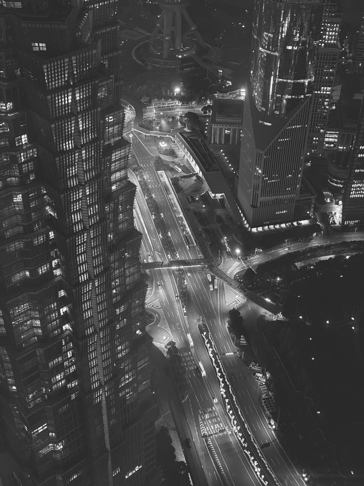 Shanghai towers and roads at night from above, black and white